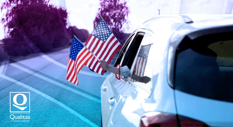 people holding american flags from a personal auto