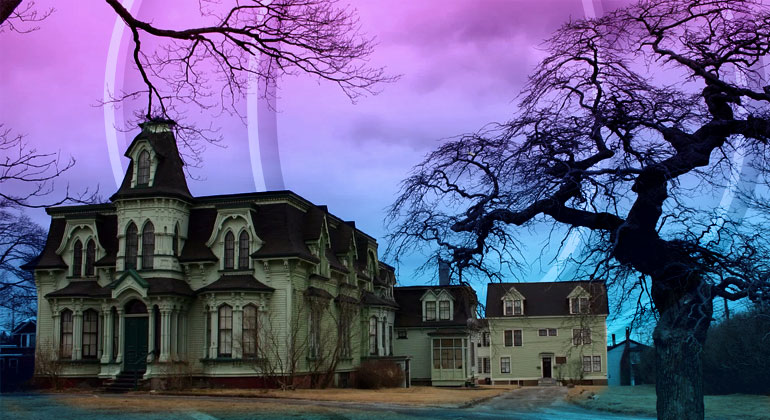 old victorian house near a dry tree